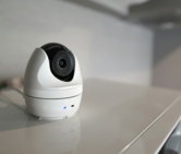 a white object with a black lens